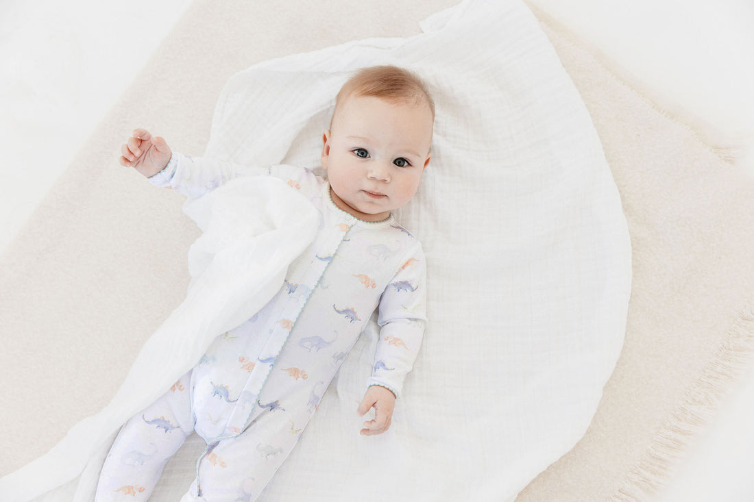 pima cotton baby footie with watercolor dinosaur print